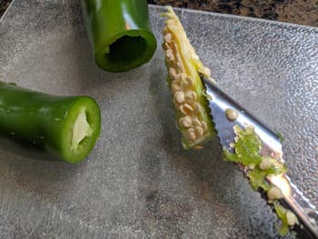 reviewer showing how the tool removed core and seeds from jalapeno pepper