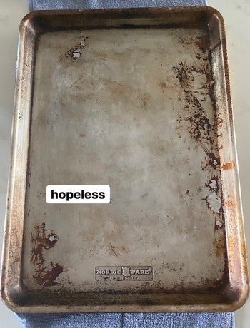 a stained sheet tray with text: hopeless