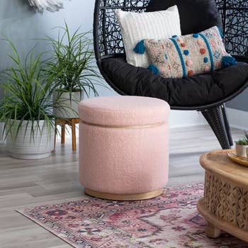 the pink ottoman closed to show the size and cylinder shape