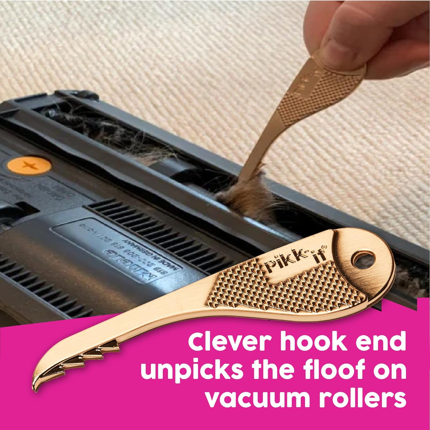 A hand uses a tool to remove hair from a vacuum cleaner’s roller, useful for maintenance