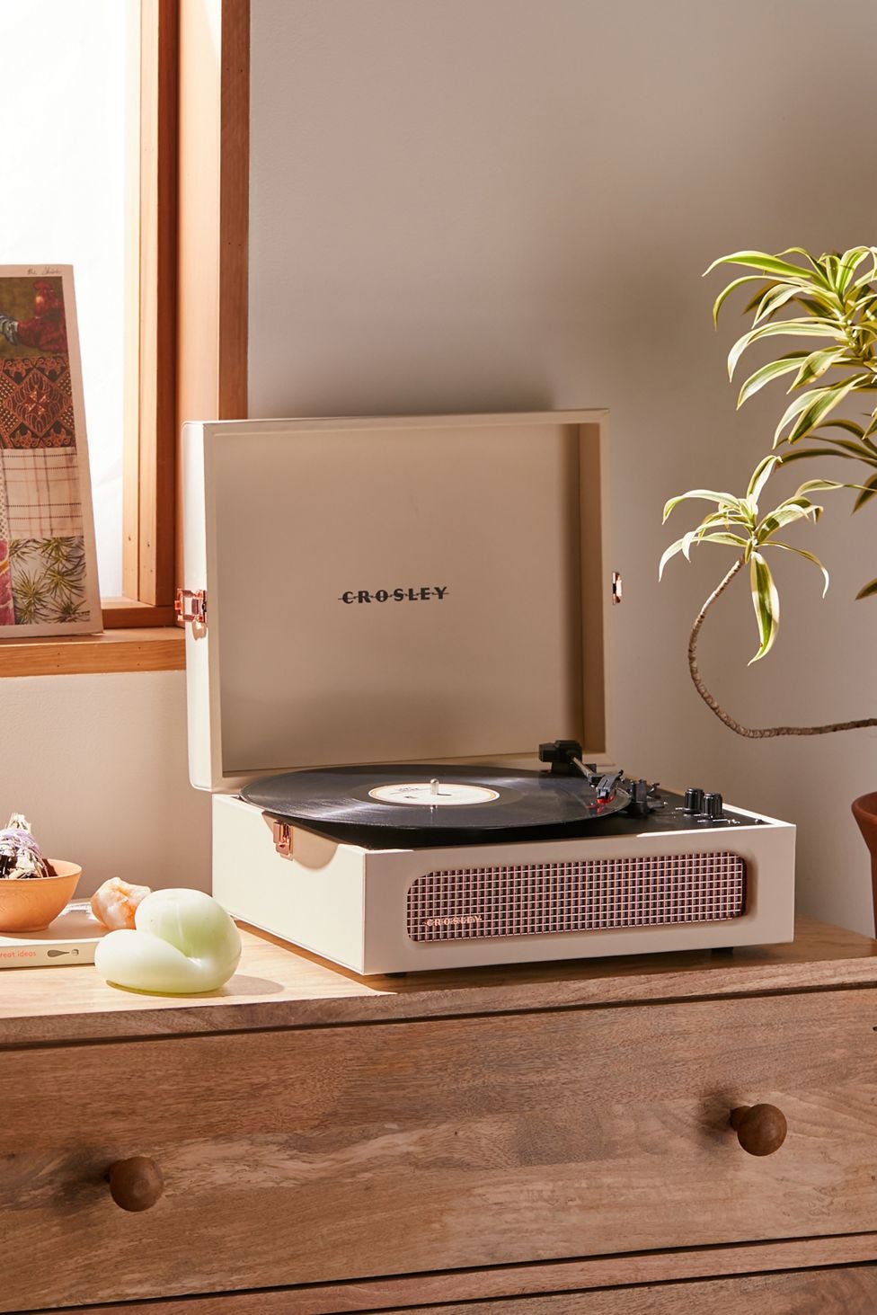 the beige and rose gold record player