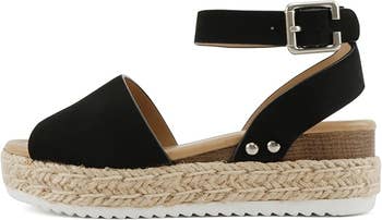 Platform sandal with an open toe, ankle strap, and woven espadrille design