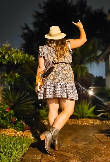 a reviewer photo of someone wearing a dress with dark brown cowboy boots