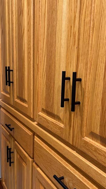 reviewer's cabinets and drawers with black matte handles