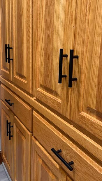 reviewer's cabinets and drawers with black matte handles