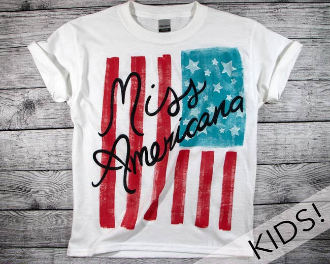 a white tee with an american flag on it and 