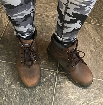 Image of reviewer wearing brown boots