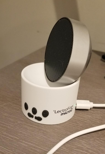 reviewer photo of the mini white noise machine on a nightstand