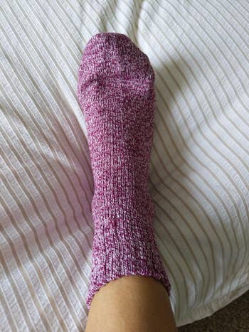 a reviewer's foot with the sock on it