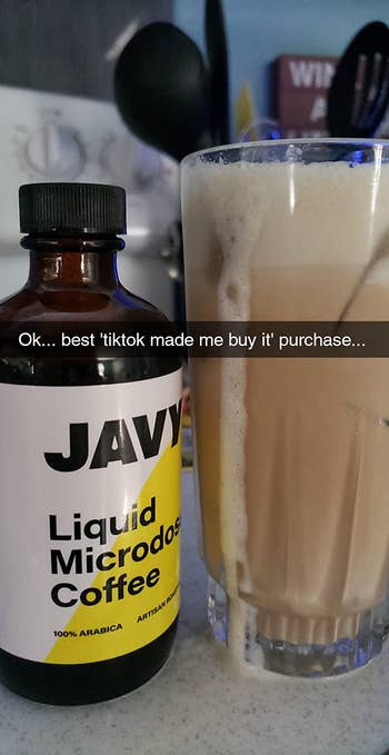 a photo of the javy concentrate bottle next to a cup of iced coffee made at home