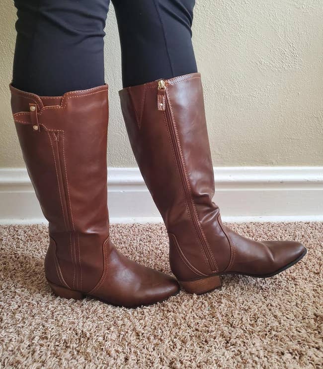 reviewer wearing the brown dr scholl's riding boots