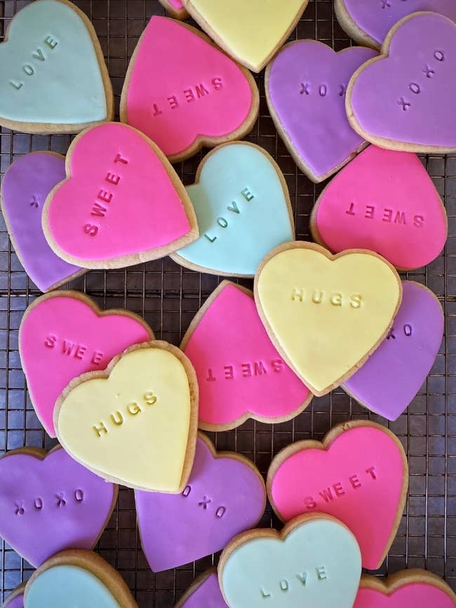 heart-shaped cookies with different sayings on them