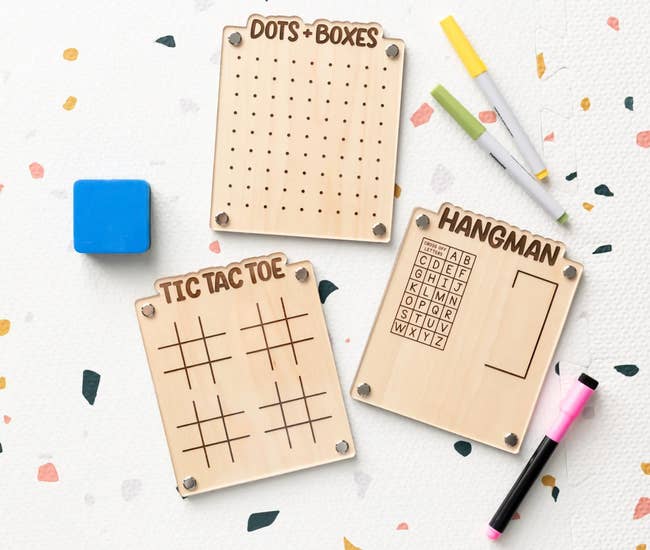 Three dry erase game boards: Tic Tac Toe, Hangman, and Dots and Boxes