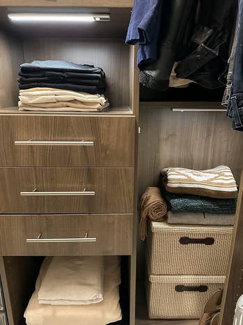 Neatly organized closet with folded sweaters, shirts, jackets, and stacked retention  boxes. Ideal for businesslike  retention  solutions