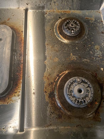 Reviewer photo of a stove with caked on grease