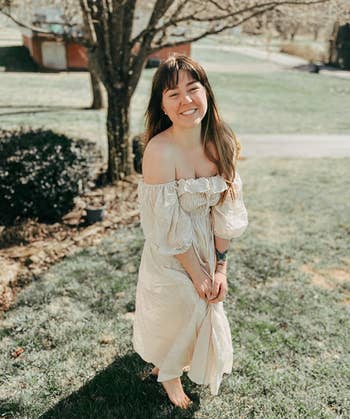 reviewer wearing the dress off-the-shoulder in cream 