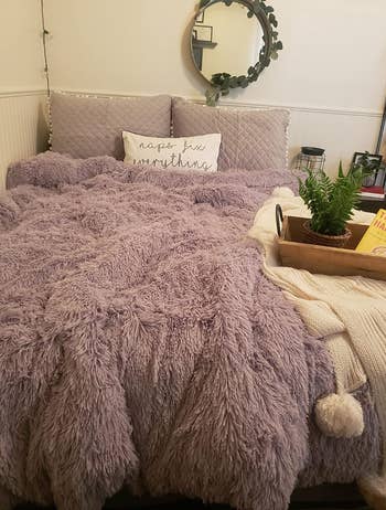 reviewers purple duvet set on their bed