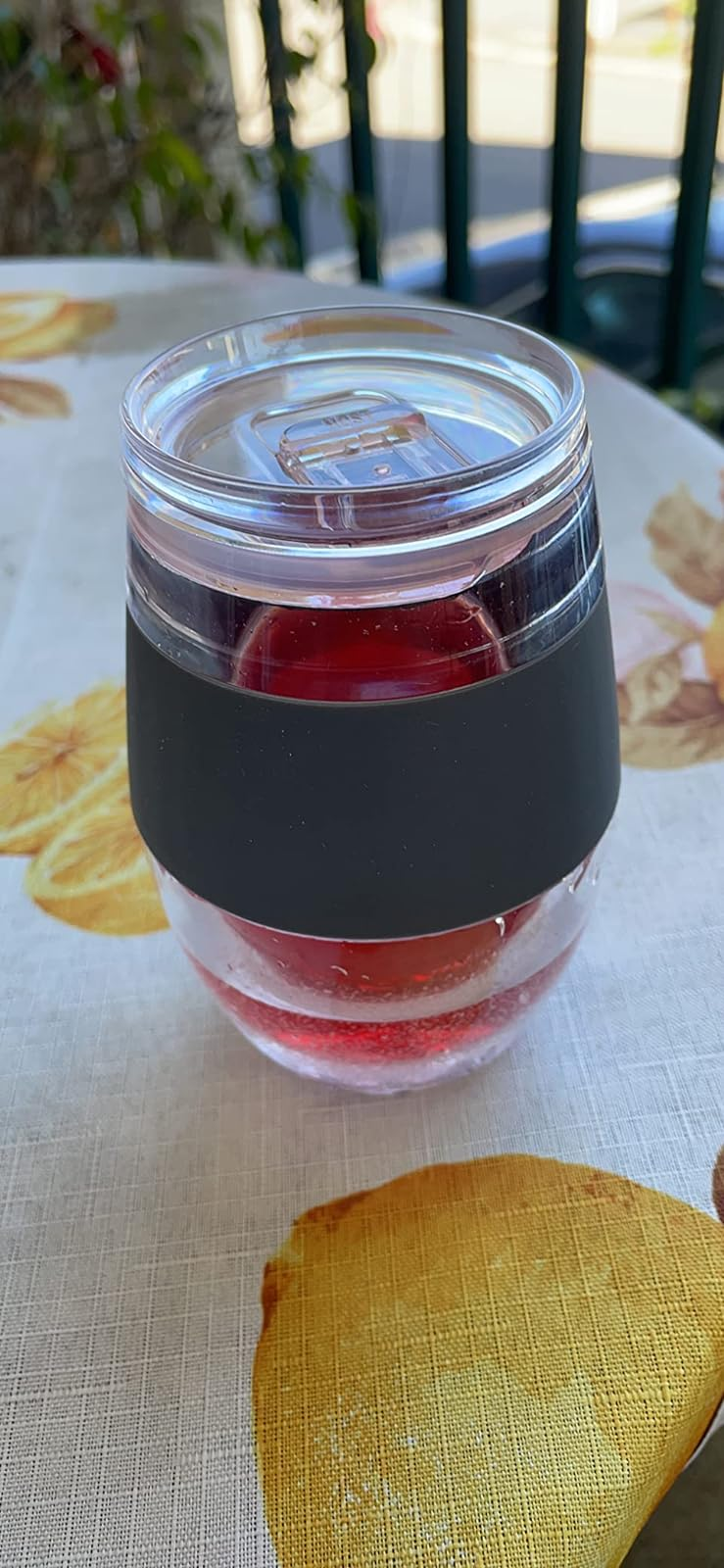 Clear integrative  cupful  with a achromatic  set  contains a reddish  drink