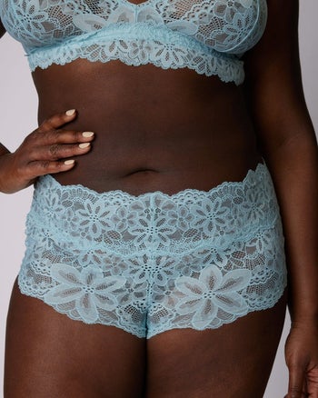 model showing the front of the lace underwear in blue