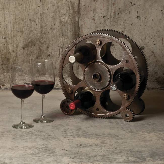 Image of the brown distressed wheel-shaped wine bottle rack