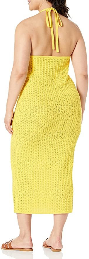 back view of the same model wearing the dress in yellow