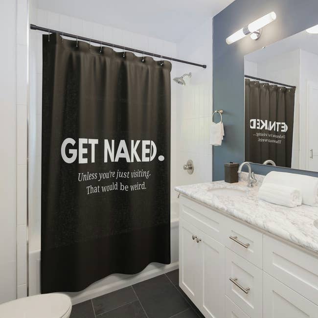 black shower curtain that says 