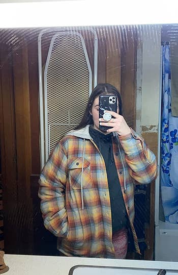 reviewer photo of them wearing a flannel shacket