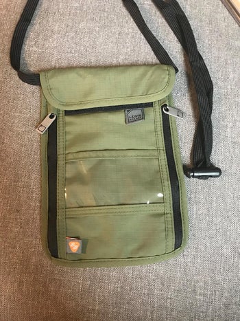 a reviewer's green neck wallet