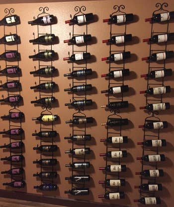 Reviewer image of 10 black wine racks on a wall