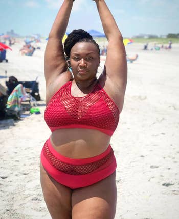 reviewer wearing bathing suit in red