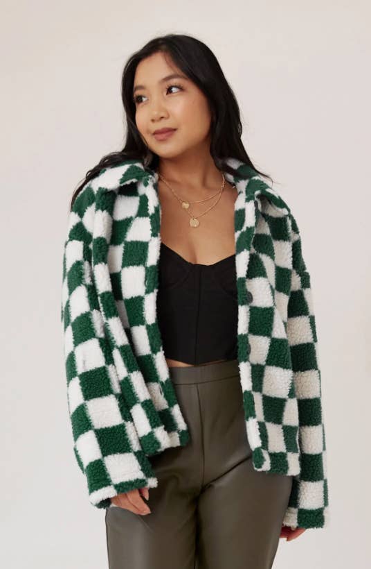 a green and white checkered sherpa coat