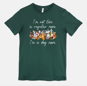  a green tee that has a big group of disney dogs on it and the words 