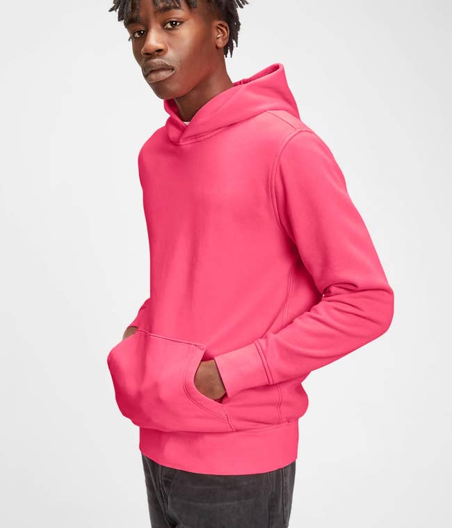 model wearing the hoodie in pink