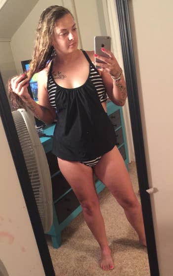 reviewer wearing the black tankini