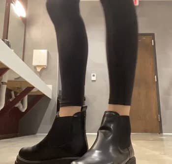 another reviewer wearing the black boots