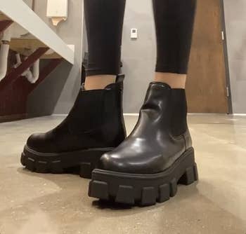 another reviewer wearing the black boots