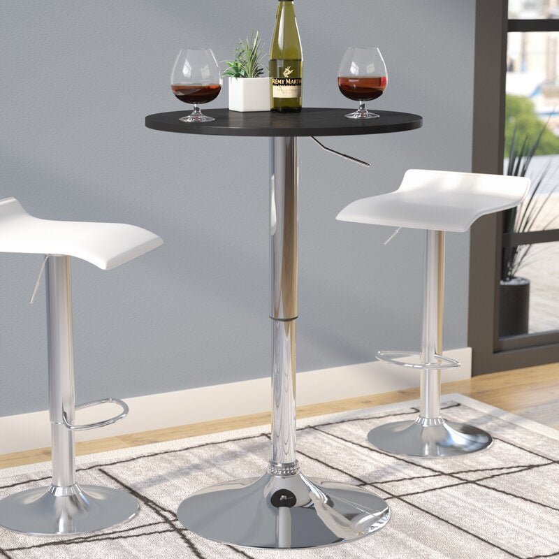 A tall black and silver table with matching chairs and wine