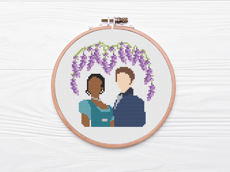 cross stitch of Kate and Anthony's silhouettes with lavender flowers