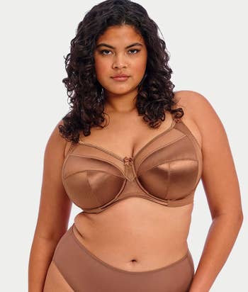 A pistillate models a sleek, supportive bra and underwear set, suitable for mundane wear, showcasing comfortableness and benignant for plus-size shoppers