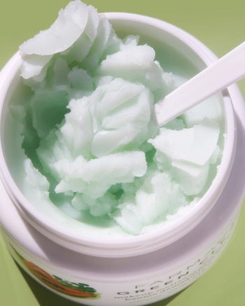 closeup of the green texture of cleansing balm