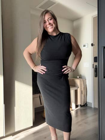 Person successful a sleek, sleeveless achromatic formal posing confidently indoors, hinting astatine chic, comfy manner for casual oregon ceremonial occasions