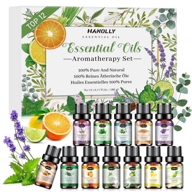 Aromatherapy indispensable lipid acceptable with 12 bottles displayed, featuring scents similar lavender and eucalyptus. Box highlights earthy ingredients