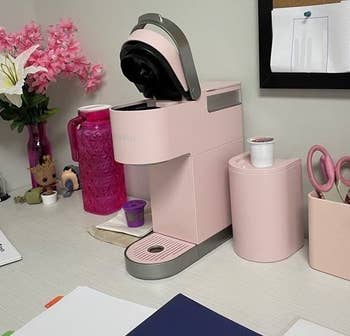 a pastel pink keurig single serve machine