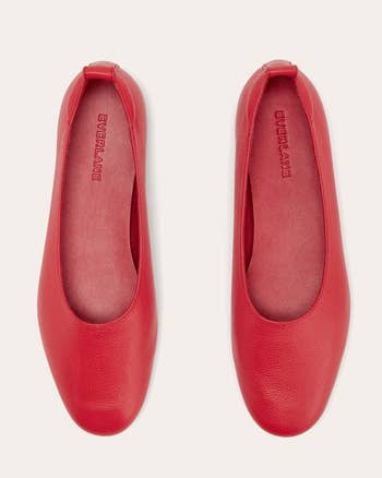 Top view of a pair of minimalist red Everlane ballet flats