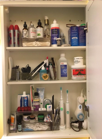  the same reviewer now showing how nice and organized the cabinet is and how they can fit so much more stuff