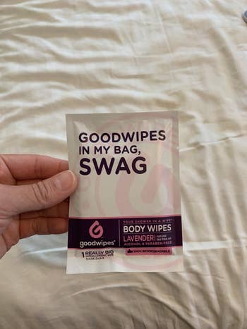 reviewer showing the small individually packed wipe