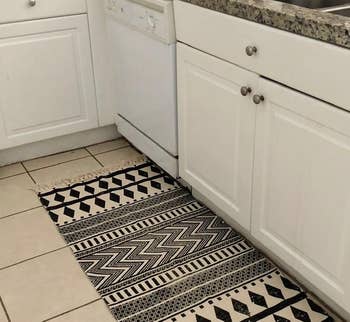 Reviewer image of the black and white rug in the kitchen