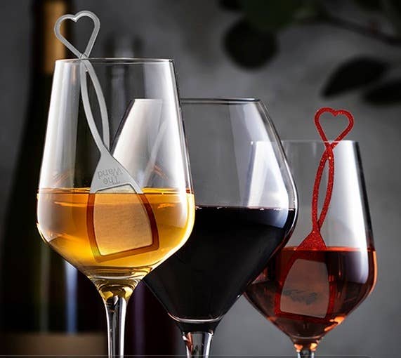 three wine glasses with red filters inside