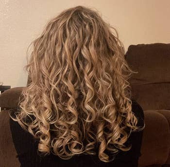 image of reviewer with blonde, ribbon-like curls