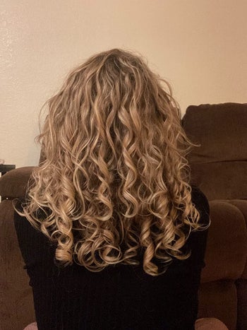 image of reviewer with blonde, ribbon-like curls